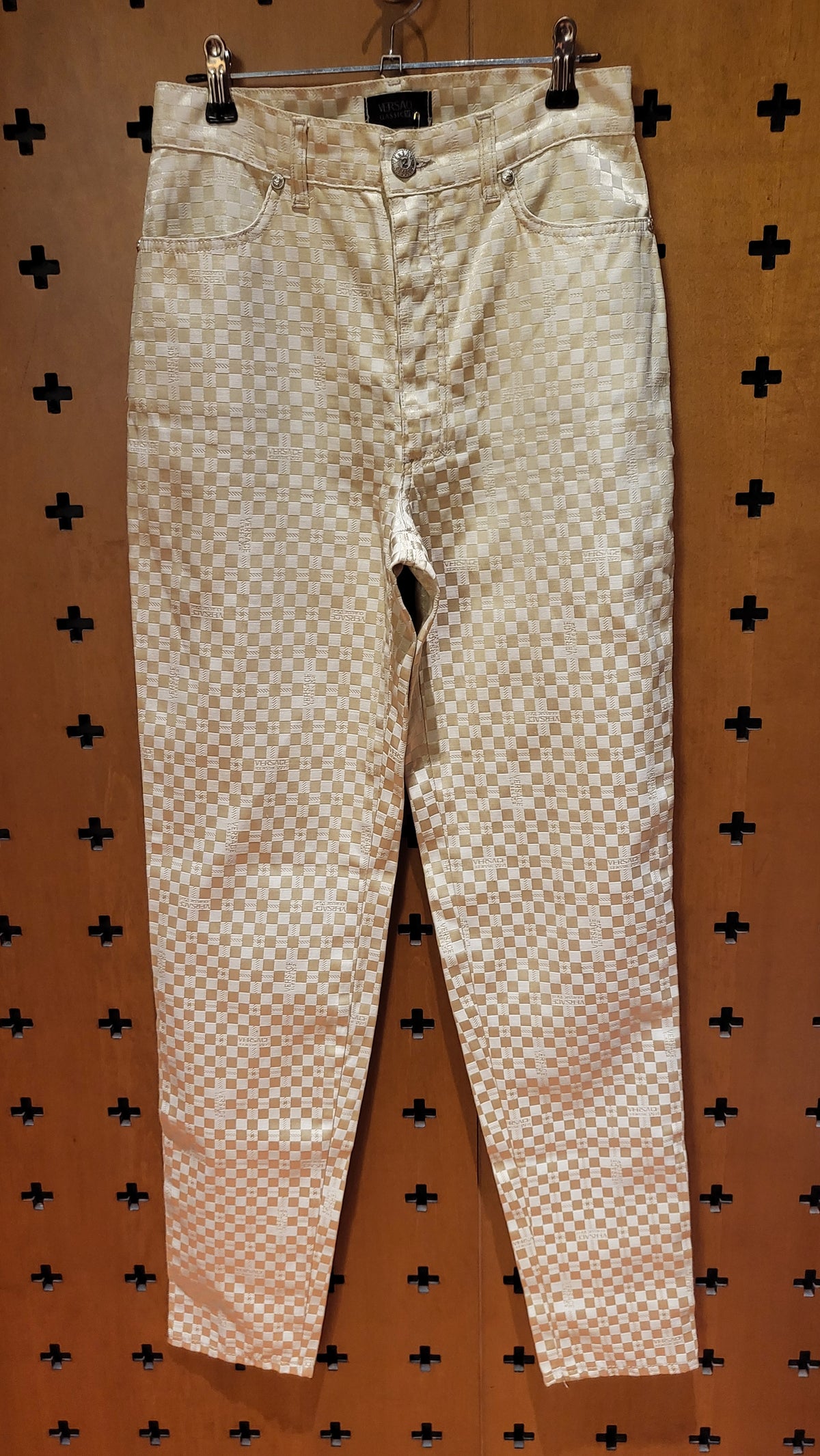 Versace V2 beige stretch logo trousers.