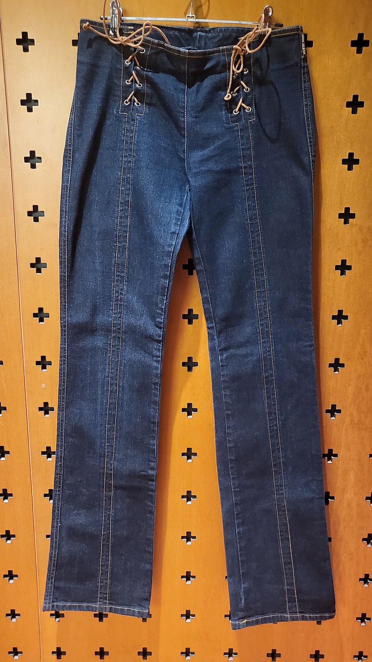 Plein Sud stretch jeans with leather lacing at hips.