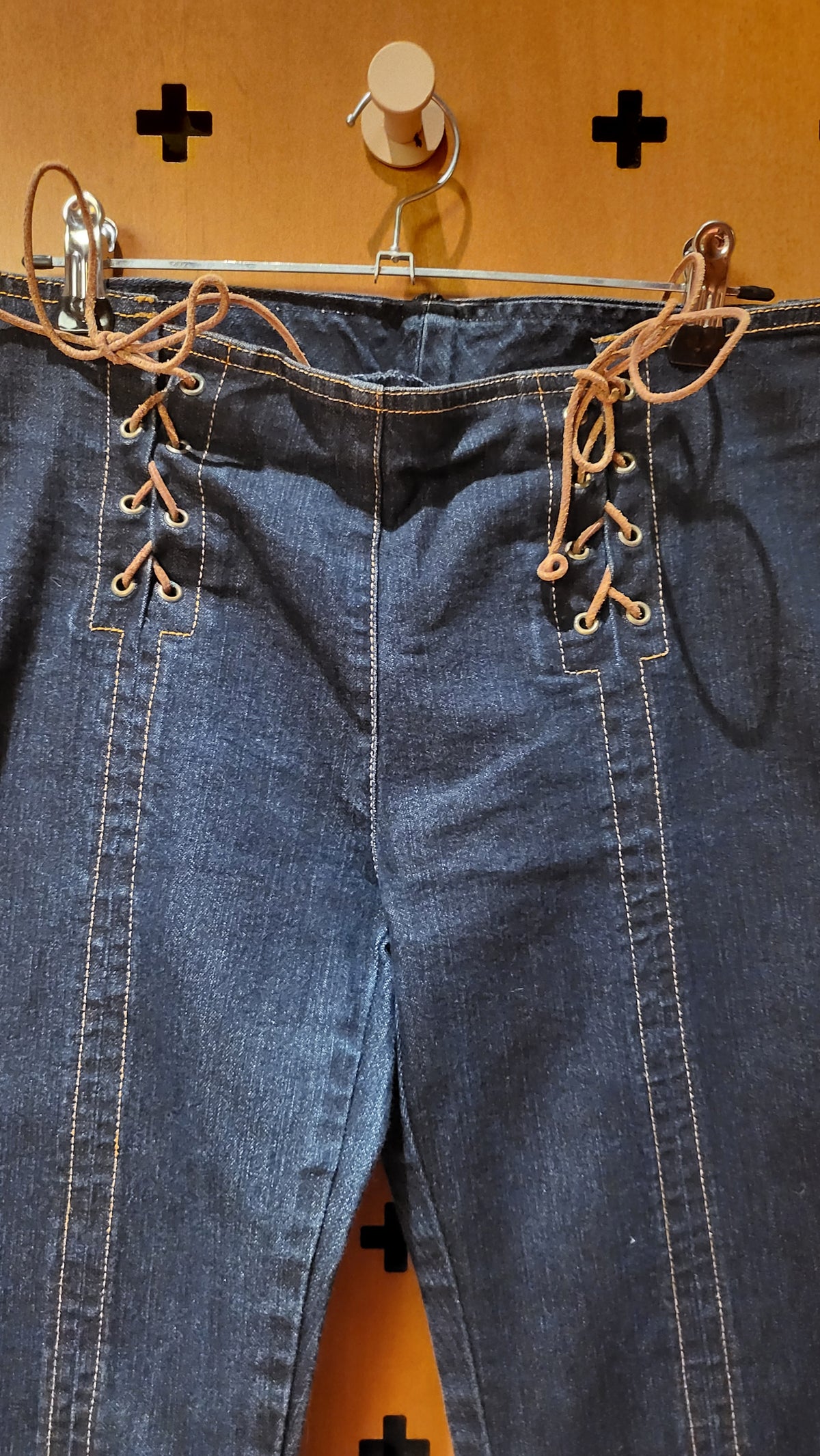 Plein Sud stretch jeans with leather lacing at hips.
