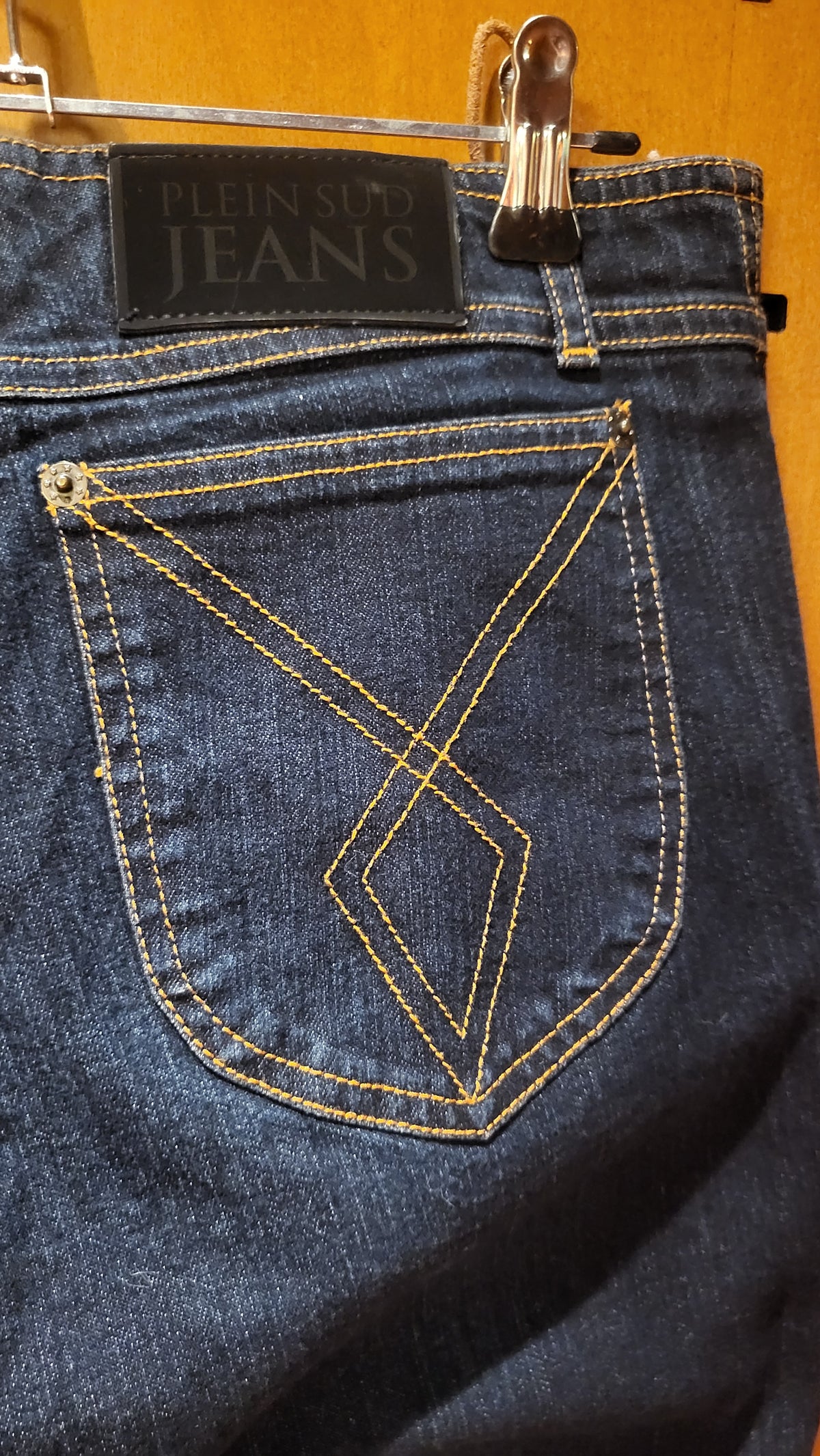 Plein Sud stretch jeans with leather lacing at hips.